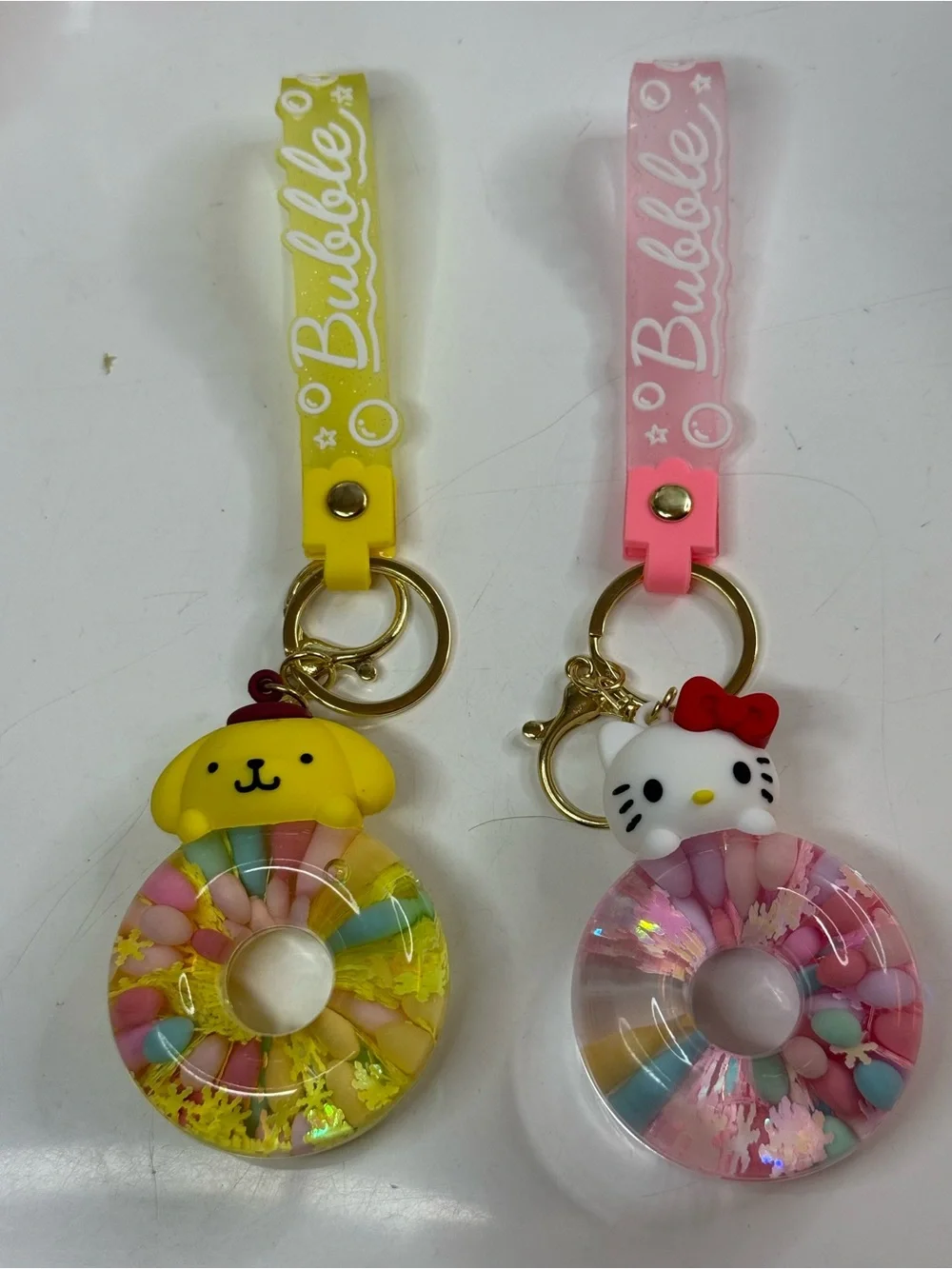 Sanrio Yellow Pompompurin & Pink Hello Kitty Donut Keychain Set